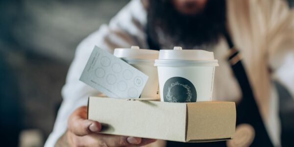 A product image of a coffee in a takeaway packaging